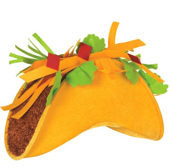 Yellow taco-shaped party decoration with brown filling, topped with green cilantro, red diced tomatoes, and orange cheese strips.
