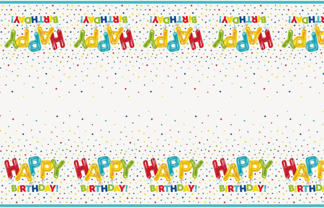 Colorful plastic tablecover featuring repeating "Happy Birthday" text in balloon letter designs and scattered confetti stars on a white background.