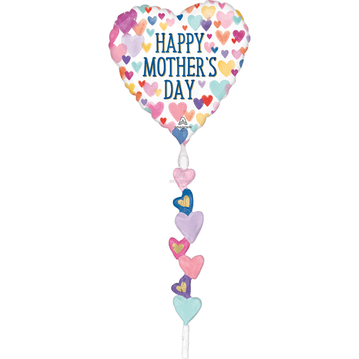 Heart-shaped foil balloon in white with colorful hearts and "Happy Mother's Day" text, featuring a dangling tail with smaller decorative hearts in pink, purple, blue, and mint green.