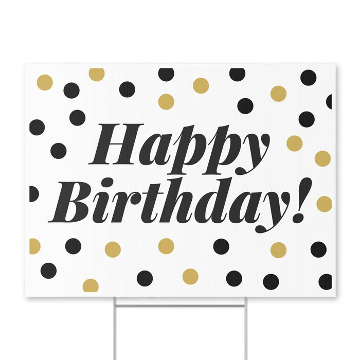 White rectangular yard sign with "Happy Birthday!" in large dark gray italic text, surrounded by a scattered pattern of black and gold circles.