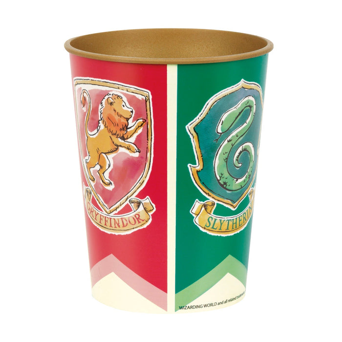 Tall plastic cup with gold interior featuring red and green vertical panels displaying Gryffindor and Slytherin house crests with animal emblems and banners.