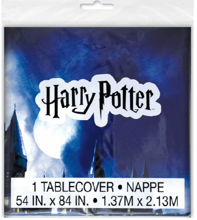 Harry Potter plastic tablecover featuring Hogwarts castle and glowing wand light against a blue background, measuring 54 by 84 inches.