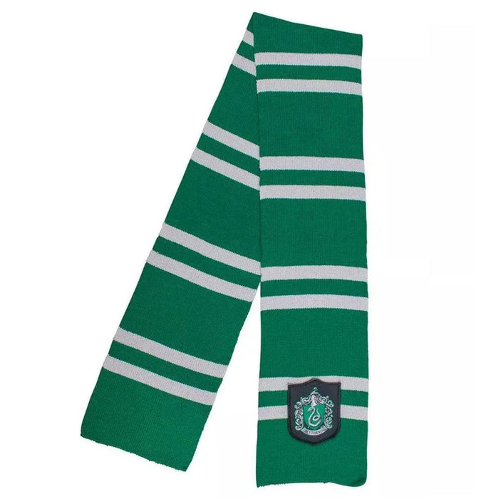 Green knit scarf with white horizontal stripes and a Slytherin house crest patch near the bottom end.