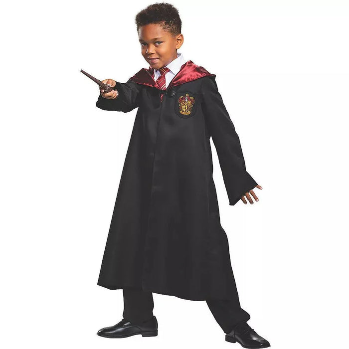 Child wearing a black wizard robe with burgundy-lined hood and gold Gryffindor crest, paired with a plaid shirt and holding a wand.