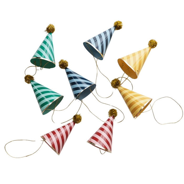 Eight striped cone party hats in green, blue, yellow, and red with gold pom-poms and elastic chin straps arranged on a white background.