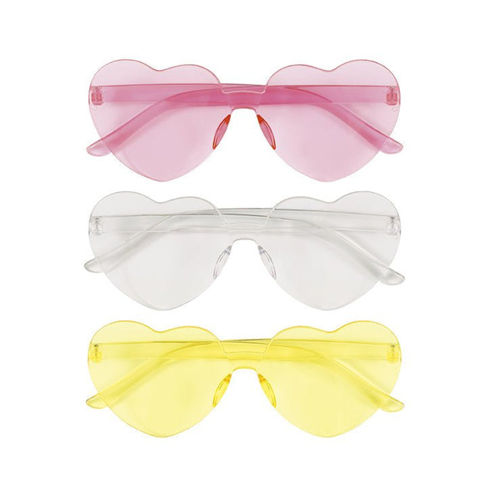Three heart-shaped sunglasses in pink, clear, and yellow tinted plastic displayed vertically in a stack.