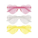Three heart-shaped sunglasses in pink, clear, and yellow tinted plastic displayed vertically in a stack.