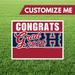 Graduation-themed customizable sign with 'Congrats Grad 2026' on a grass background