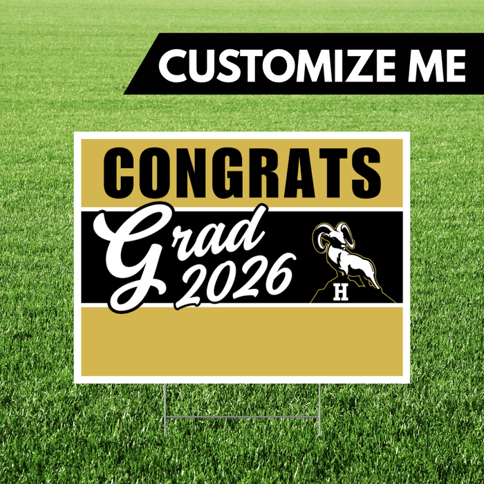 Graduation-themed sign with 'Congrats Grad 2026' on a grass background