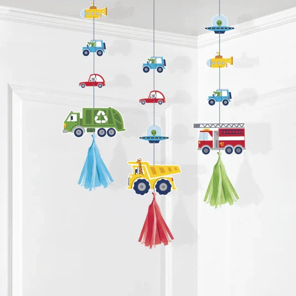 Three colorful hanging mobile decorations featuring illustrated vehicles including cars, trucks, fire engines, garbage trucks, and airplanes suspended from fabric tassels in blue, red, and green.