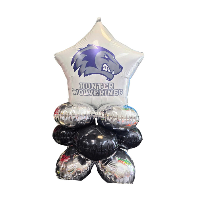 Hunter Wolverines star-shaped foil balloon in silver and purple with a wolverine logo, topped with four silver and black round balloons arranged in a cluster.