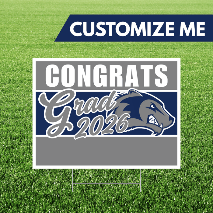 Graduation-themed sign with 'Congrats Grad 2026' on a grass background