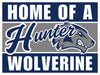 Navy and gray yard sign featuring a Hauler Wolverine mascot logo with white text reading "Home of a Hauler" and "Wolverine" on top and bottom bands.