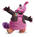 Pink furry character with a long curved tail topped with a heart shape, wearing a brown tweed jacket with a colorful flower pin and purple bow tie, with an enthusiastic expression and outstretched arms.