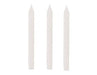Three tall white taper candles with pointed tips arranged side by side against a light background.