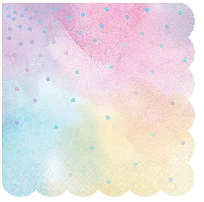 Pack of 16 iridescent napkins with scalloped edges featuring a gradient watercolor design transitioning from pink and purple at the top to blue and yellow at the bottom, scattered with small holographic dots.