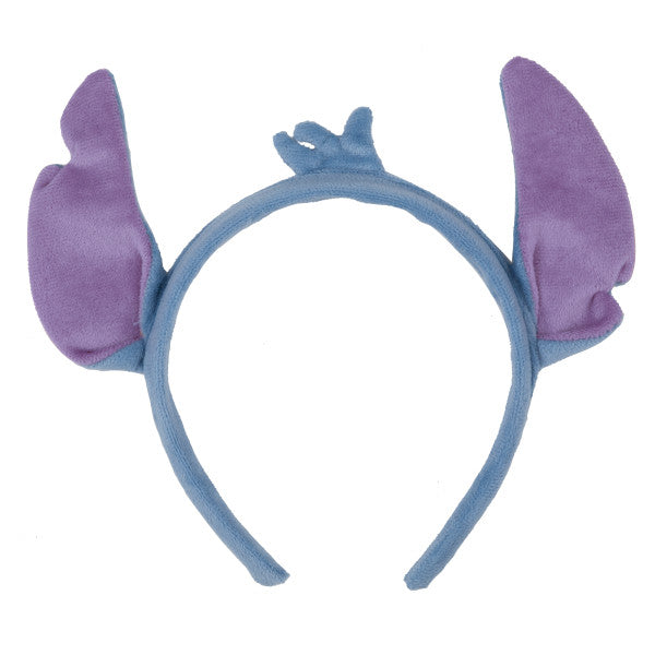 Guest Of Honor Stitch headband with soft blue band, plush purple ears, and small crown detail on a white background.