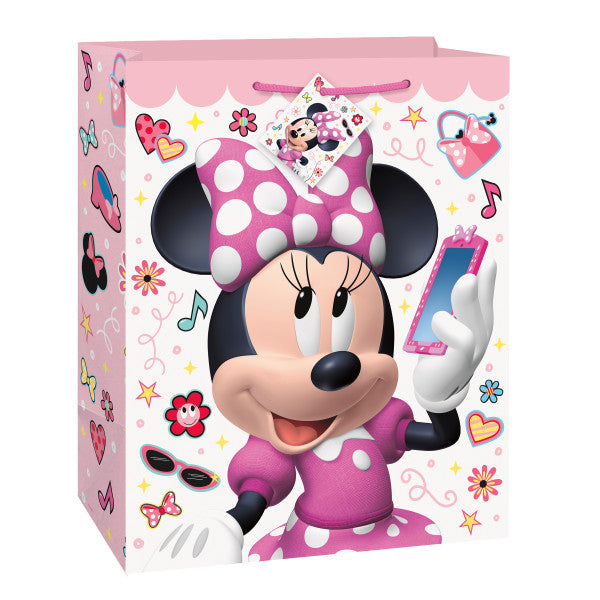 Large Minnie Mouse gift bag with pink background, Minnie artwork, polka dot bow, hearts, flowers, music notes, and colorful party designs.