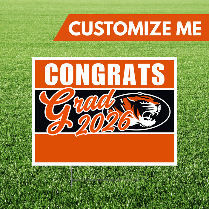 Graduation-themed sign with tiger logo and 'Congrats Grad 2026' text on a grass background