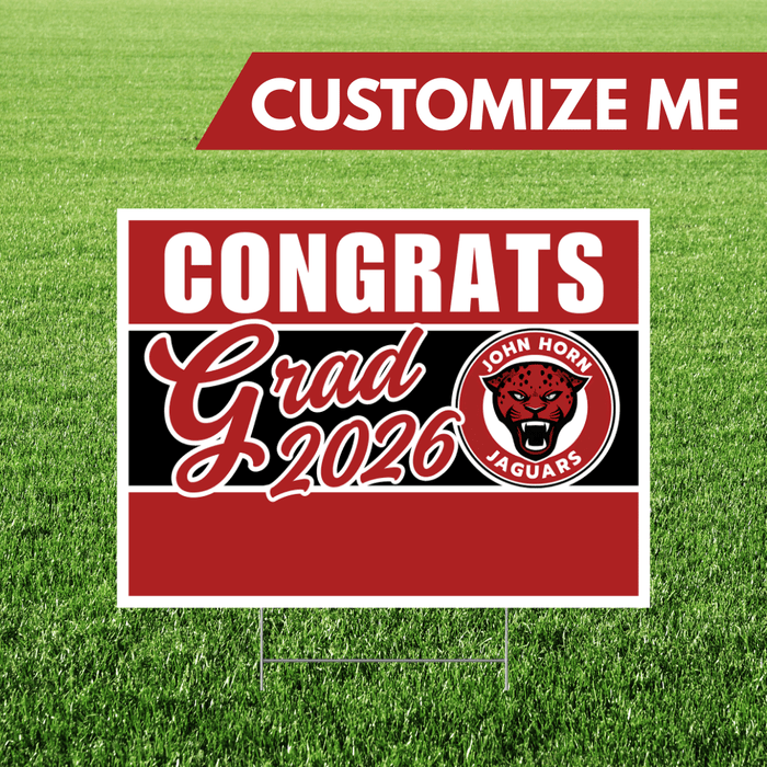 Red and black yard sign with white text reading "CONGRATS Grad 2026" and a red jaguar mascot logo, mounted on a white border frame with metal stakes.