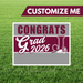 Graduation-themed customizable sign with 'Congrats Grad 2026' on a grass background