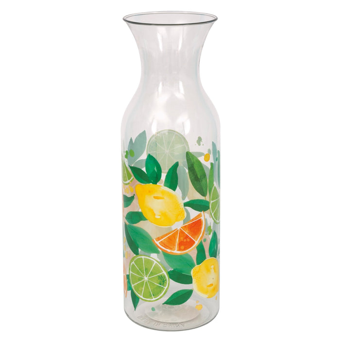 Clear glass carafe with a tapered shape decorated with illustrated lemons, limes, orange slices, and green leaves in yellow, orange, and green tones.