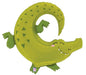 Green foil balloon shaped like a smiling alligator with triangular scale patterns, curved tail, and outstretched limbs in a playful pose.