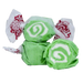 Three pieces of bright green salt water taffy with white spiral designs and pink and red patterned cellophane wrappers.