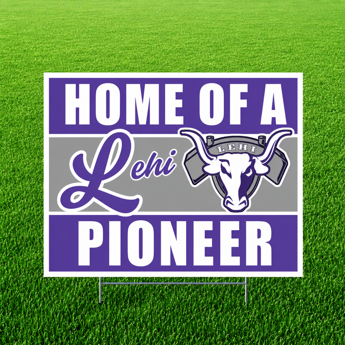 Lehi Pioneers "Home of a Lehi Pioneer" graduation yard sign displayed on a green grass lawn. The square sign features bold purple and white text with a gray center stripe, the Lehi script logo, the official Lehi High School pioneer bull mascot logo, and includes an H-stake for easy yard installation.