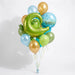 Baby balloon bouquet featuring a green alligator-shaped foil balloon, a blue “Hello World!” balloon, and gold, blue, teal and two shades of green latex balloons with curling ribbons.