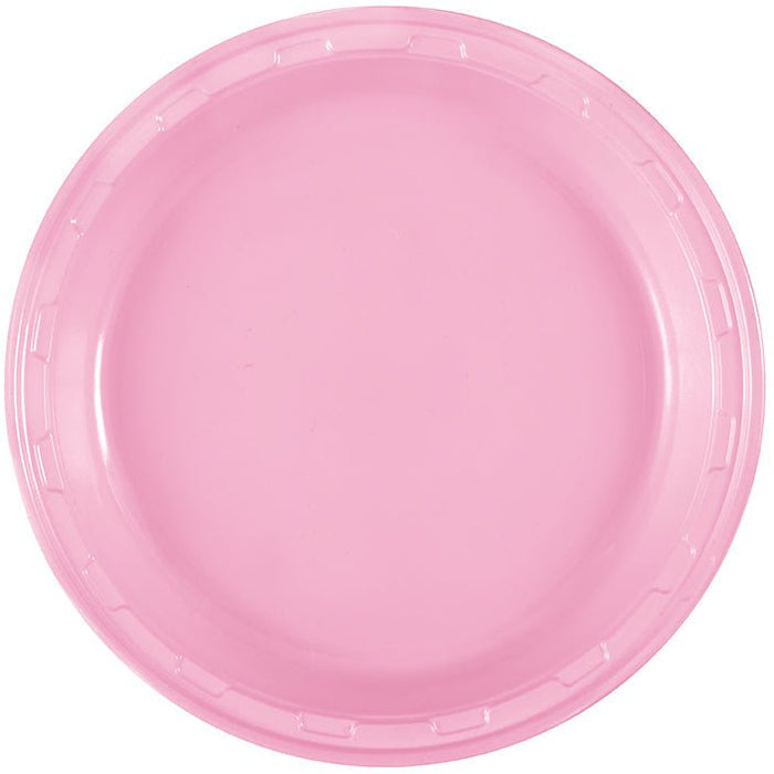 Bright pink disposable plastic plate with a ridged rim, shown from above against a white background.