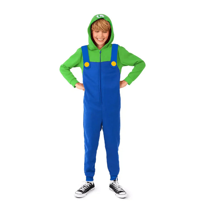 Child wearing a green and blue Luigi costume onesie with yellow button details, green hood, and black sneakers.