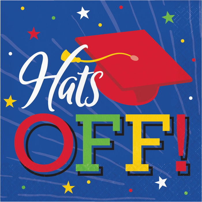Colorful napkins featuring "Hats Off!" text in white script with a red graduation cap, surrounded by stars and dots on a blue background.