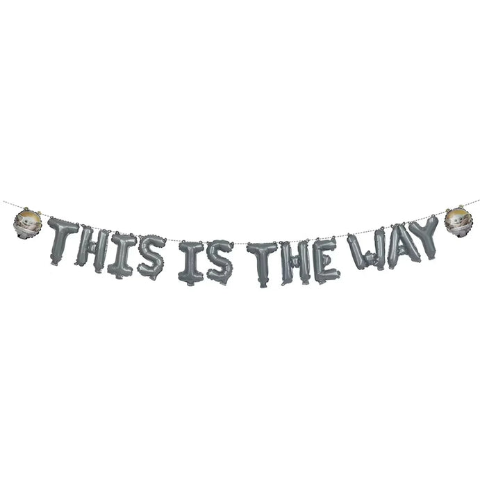 Gray metallic letter balloons spelling "THIS IS THE WAY" strung on a dotted line with two small metallic sphere balloons on each end.