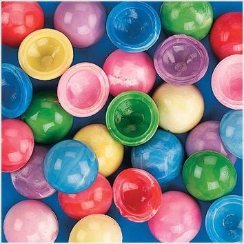 Colorful assorted marble poppers arranged on a blue background, including red, pink, blue, green, and yellow translucent spheres with globe designs.