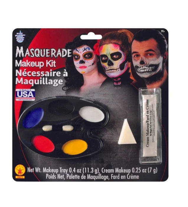 Masquerade makeup kit featuring a black palette with five colorful cream makeup wells in blue, white, red, and yellow, plus a separate tube of cream makeup and a white makeup sponge applicator.