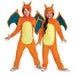Two children wearing orange and yellow dragon costumes with teal wings, pointed ears, and clawed hands posed against a white background.