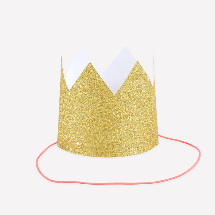 Mini Gold Glitter Crown with sparkling gold finish, pointed crown shape, and pink elastic cord on a white background.