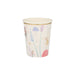 Fairy party cup with pastel fairy illustrations, flowers, mushrooms, greenery, tiny stars, and a shiny gold rim on a cream background.