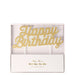 Gold Happy Birthday Candle in white packaging with gold script lettering mounted on white cake picks.