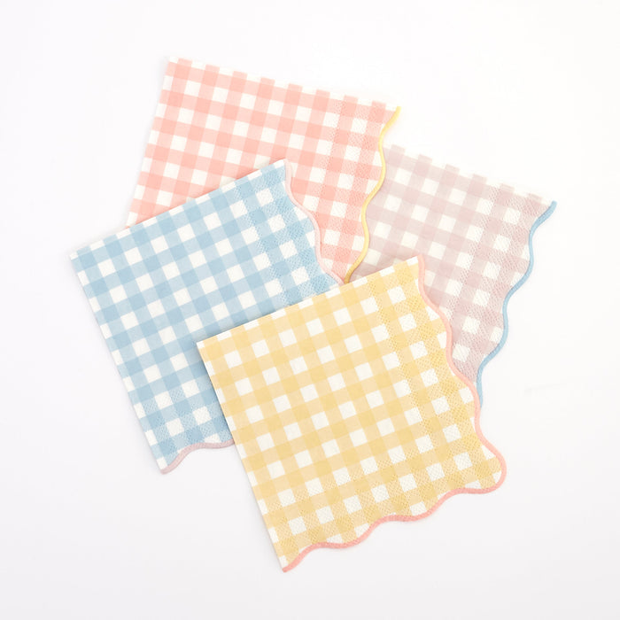 Gingham Small Napkins in assorted pastel pink, blue, yellow, and blush checkered patterns with scalloped edges on a white background.