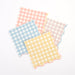 Gingham Small Napkins in assorted pastel pink, blue, yellow, and blush checkered patterns with scalloped edges on a white background.