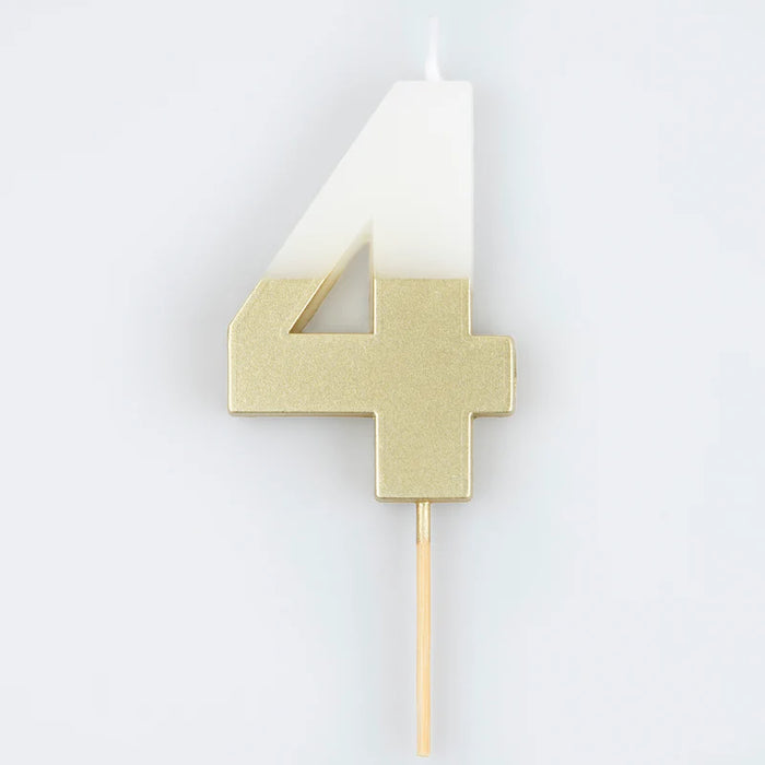 White number 4 cake candle with metallic gold dipped finish and wooden pick on a white background.
