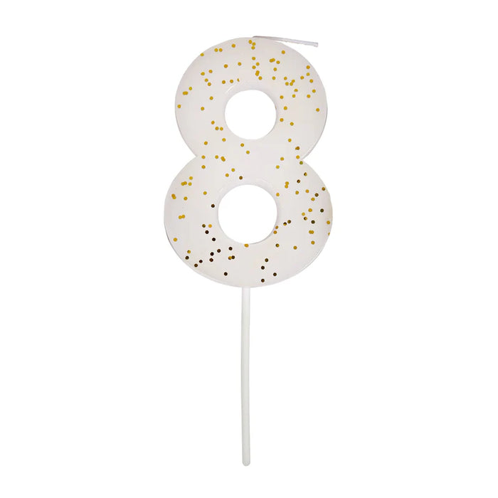 White number 8 cake candle with gold speckle accents and white pick on a white background.