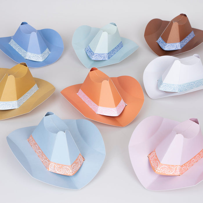 Mini Western Party Hats in assorted pastel and western colors with cowboy hat shapes and bandana-style trim.
