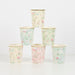 Floral Garden Cups arranged in a pyramid with pastel floral patterns, leafy vines, butterflies, and gold rims on a white background.
