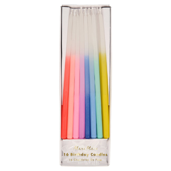Rainbow Dipped Tapered Candles in clear packaging with white candles dipped in assorted bright colors.