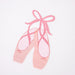 Ballet Slippers Napkins shaped like pink ballet shoes with ribbon details, designed for ballerina-themed parties.
