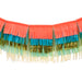 Colorful Fringe Large Garland with layered coral, teal, mint, cream, and metallic gold fringe on a white background.