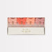 Pink Bow Candles in four assorted pastel shades, including soft pink, coral, peach, and mauve, displayed in a box.
